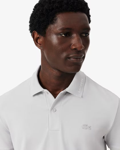 Lacoste · Polo uomo slim piqué logo jacquard grigio