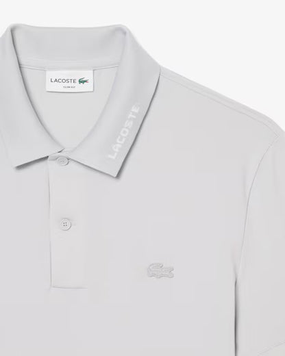 Lacoste · Polo uomo slim piqué logo jacquard grigio