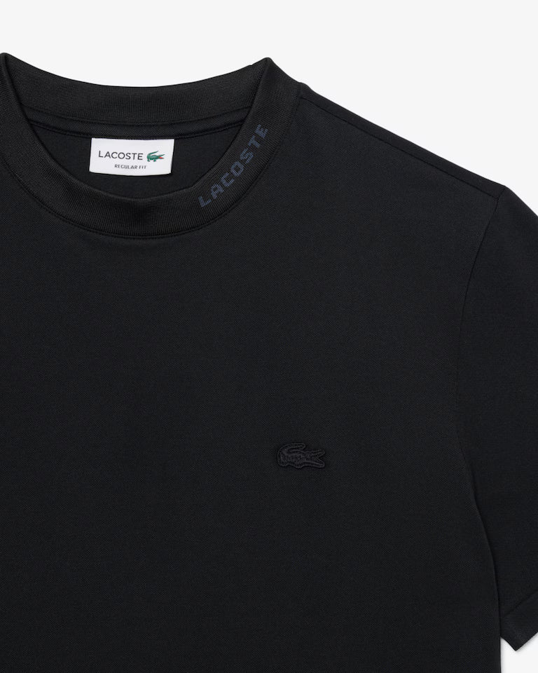 Lacoste · T-shirt uomo piqué jacquard Commuter nero